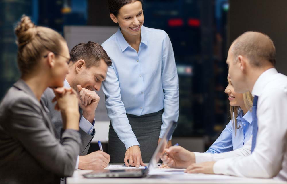 Smiling Business Team at Meeting Table