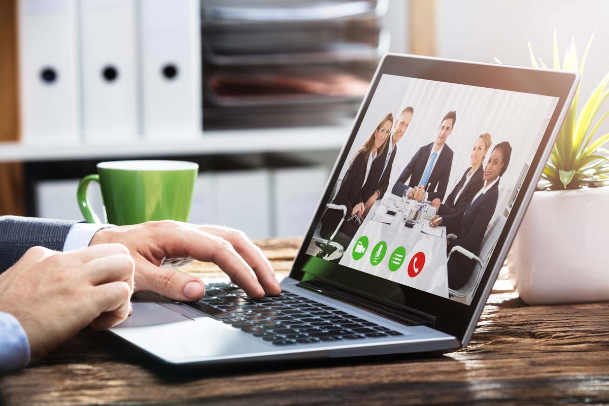 Business Team in Video Conference on Laptop Computer