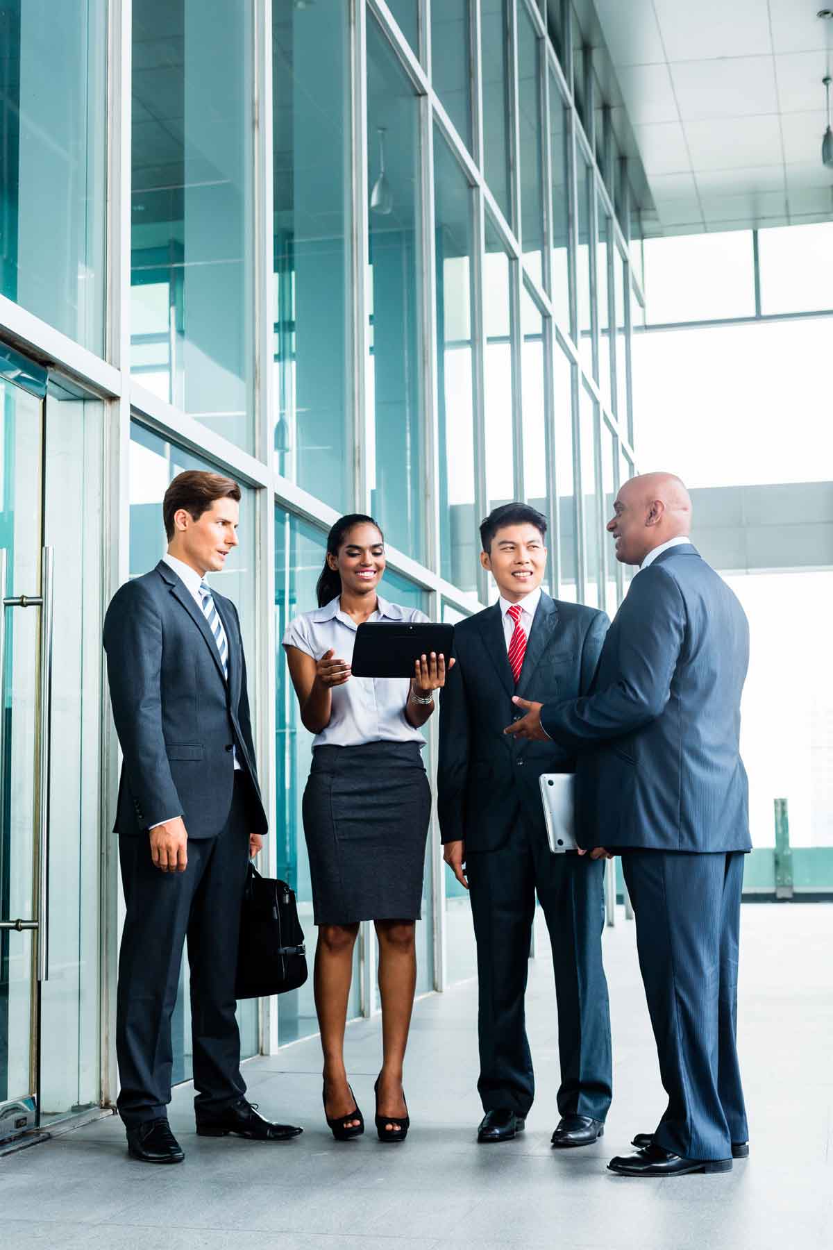 Business Team Meeting In Front of Commercial Building