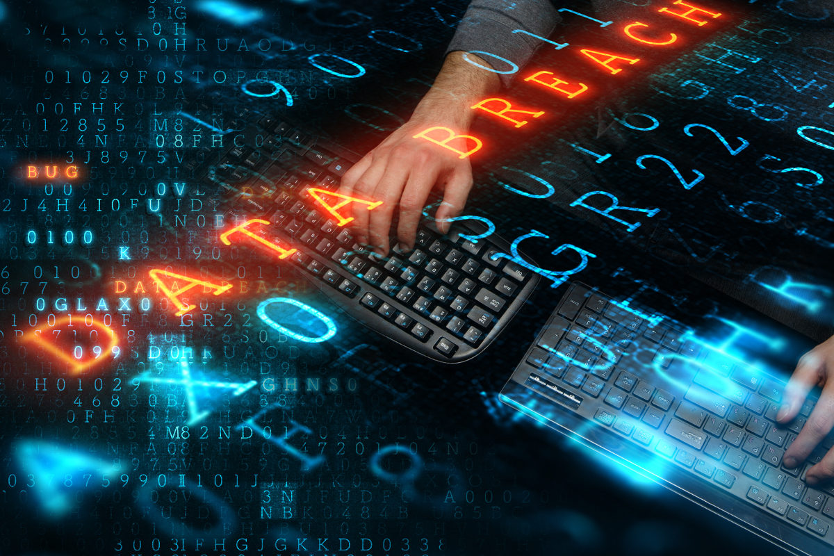 Hacker working on keyboards