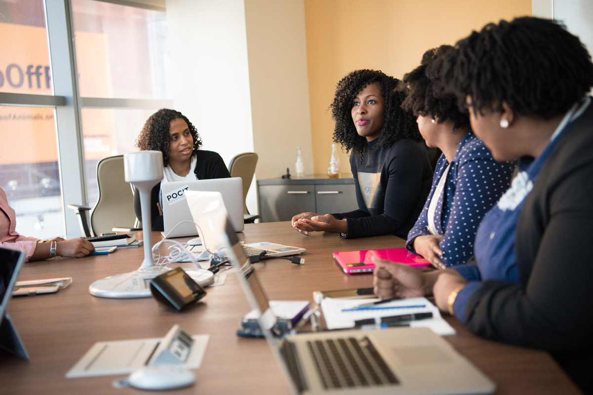 Group of business people meeting around a conference table